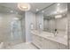 Modern bathroom with dual sinks, quartz countertops, and a luxurious glass-enclosed shower at 301 1St S St # 2104, St Petersburg, FL 33701