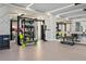 Spacious gym with various exercise equipment, weights, and mirrored walls for a complete workout experience at 301 1St S St # 2104, St Petersburg, FL 33701