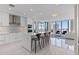 Modern kitchen features an island with seating, stainless steel appliances, and a view of the city at 301 1St S St # 2104, St Petersburg, FL 33701