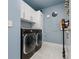 Well-organized laundry room with modern washer and dryer and ample storage at 301 1St S St # 2104, St Petersburg, FL 33701