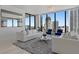 Modern living room featuring contemporary furnishings, a stylish rug, and floor-to-ceiling windows with city views at 301 1St S St # 2104, St Petersburg, FL 33701