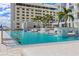 Stunning pool area with submerged lounge chairs, waterfall feature, and ample seating at 301 1St S St # 2104, St Petersburg, FL 33701