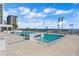 Rooftop pool area with pristine water, sun loungers, and stunning skyline views at 301 1St S St # 2104, St Petersburg, FL 33701