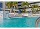 Community pool with lounge seating, waterfall feature, and clear blue water at 301 1St S St # 2104, St Petersburg, FL 33701