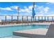 Beautiful rooftop pool with lounge chairs, umbrellas and spectacular water view at 301 1St S St # 2104, St Petersburg, FL 33701