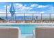 Rooftop pool features comfortable lounge chairs and stunning harbor views at 301 1St S St # 2104, St Petersburg, FL 33701