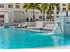 Luxury pool with lounge chairs, waterfall features, and lush palm trees for a resort-style experience at 301 1St S St # 2104, St Petersburg, FL 33701