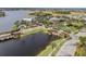 Scenic aerial view of the community clubhouse, surrounded by lush landscaping and waterfront features at 310 Blackrock Ln, Apollo Beach, FL 33572