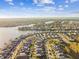 Panoramic aerial view featuring a vibrant community nestled amidst picturesque lakes and coastal landscapes at 310 Blackrock Ln, Apollo Beach, FL 33572