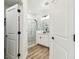 Modern bathroom showcasing a glass-enclosed shower, double vanity, and stylish fixtures at 310 Blackrock Ln, Apollo Beach, FL 33572