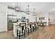 Modern kitchen with white cabinets, stainless steel appliances, and bar seating at 310 Blackrock Ln, Apollo Beach, FL 33572