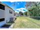 Exterior view of the property highlighting the fence and A/C unit at 4529 Olive Dr, Zephyrhills, FL 33542