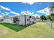 Home exterior showcasing the well-maintained lawn and fenced yard at 4529 Olive Dr, Zephyrhills, FL 33542