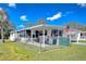 Single-story home boasting a fenced yard and screened-in porch, perfect for enjoying the outdoors at 4529 Olive Dr, Zephyrhills, FL 33542