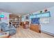 Bright and airy living room features a seamless layout for dining and entertaining at 4529 Olive Dr, Zephyrhills, FL 33542