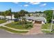 A beautiful aerial view of a single Gathering home with a well-manicured lawn and mature trees at 4706 Shale Pl, Tampa, FL 33615