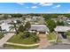 A picturesque aerial shot of a single-Gathering home, showcasing its landscaped yard and neighborhood setting at 4706 Shale Pl, Tampa, FL 33615