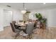 Dining room with a modern chandelier, a dining table with seating, and stylish decor at 4706 Shale Pl, Tampa, FL 33615