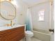 Modern bathroom featuring a vanity with gold fixtures, tub and overhead lighting at 4710 23Rd S Ave, St Petersburg, FL 33711