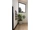 Bright hallway featuring a large window, indoor plant, and artwork at 4900 59Th S Ave, St Petersburg, FL 33715