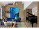 Open living room featuring high ceilings, exposed brick, modern furniture, and a grand piano at 4900 59Th S Ave, St Petersburg, FL 33715