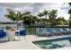 Waterfront patio area featuring a refreshing pool, lounge chairs, and outdoor dining space at 4900 59Th S Ave, St Petersburg, FL 33715