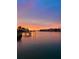 Beautiful waterfront sunset view featuring a calm bay, docks, and colorful sky at 4900 59Th S Ave, St Petersburg, FL 33715