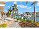 Beautiful backyard with lush tropical landscaping and private boat dock at 4930 60Th S Ave, St Petersburg, FL 33715