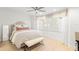 Bright bedroom with hardwood floors, neutral walls, modern furnishings, and a picture window at 4930 60Th S Ave, St Petersburg, FL 33715