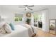 Serene bedroom with light wood floors, and sliding doors leading to an outdoor patio at 4930 60Th S Ave, St Petersburg, FL 33715