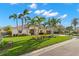 Charming single-story home featuring lush landscaping, mature trees, and a barrel tile roof at 4930 60Th S Ave, St Petersburg, FL 33715