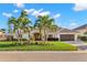 Inviting home with verdant lawn and swaying palms at 4930 60Th S Ave, St Petersburg, FL 33715