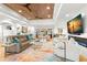 Bright living room with a modern fireplace and a sliding door leading to the pool area at 4930 60Th S Ave, St Petersburg, FL 33715