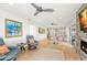 Bright living room features tile floors, fireplace and comfortable seating adjacent to the modern kitchen and dining area at 4930 60Th S Ave, St Petersburg, FL 33715