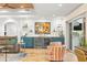 Bright living room featuring travertine floors, a wet bar, and sliding doors to the backyard at 4930 60Th S Ave, St Petersburg, FL 33715