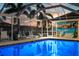 Enjoy swimming year-round in this fabulous screened-in pool, complete with lounge chairs at 4930 60Th S Ave, St Petersburg, FL 33715