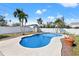 Backyard featuring an in-ground pool, privacy fence, tropical landscaping, and storage shed at 5926 Bayou Grande Ne Blvd, St Petersburg, FL 33703