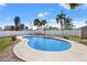 Inviting backyard pool surrounded by well-maintained landscaping and a privacy fence on a bright, sunny day at 5926 Bayou Grande Ne Blvd, St Petersburg, FL 33703