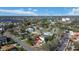Aerial view of a home in a waterfront community with mature trees, lush greenery, and beautiful views at 601 Cordova Ne Blvd, St Petersburg, FL 33704