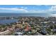Aerial view of a home in a waterfront community with beautiful waterfront views, and mature trees at 601 Cordova Ne Blvd, St Petersburg, FL 33704