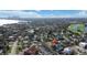Aerial view of a home in a beautiful neighborhood close to a city and golf course, lush landscaping, and waterfront views at 601 Cordova Ne Blvd, St Petersburg, FL 33704