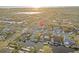 An aerial view of the neighborhood with waterfront homes and access to the bay and gulf at 6104 Dory Way, Tampa, FL 33615