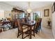 Charming dining room with a classic chandelier, elegant table, and a display cabinet at 6104 Dory Way, Tampa, FL 33615