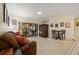 A cozy living room showcasing a comfortable sofa, sliding glass doors, and accent furniture pieces at 6104 Dory Way, Tampa, FL 33615