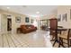 Inviting living room featuring tile floors, comfortable seating, and sliding glass doors to the outside at 6104 Dory Way, Tampa, FL 33615