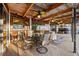 Covered patio features a ceiling fan, dark wooden beams, dark trim, and outdoor seating at 6104 Dory Way, Tampa, FL 33615