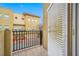 Balcony view overlooking neighboring building with railing and tile flooring at 615 Olive Tree Ct, Clearwater, FL 33756