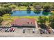 Beautiful aerial view of a clubhouse near the lake and lush green golf course at 7078 Lexington Cir, Brooksville, FL 34602