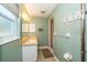 Bright bathroom featuring a marble countertop, decorative wall art, and a walk-in shower at 7078 Lexington Cir, Brooksville, FL 34602