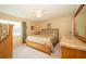 Serene bedroom with a ceiling fan, neutral décor, and plenty of natural light at 7078 Lexington Cir, Brooksville, FL 34602